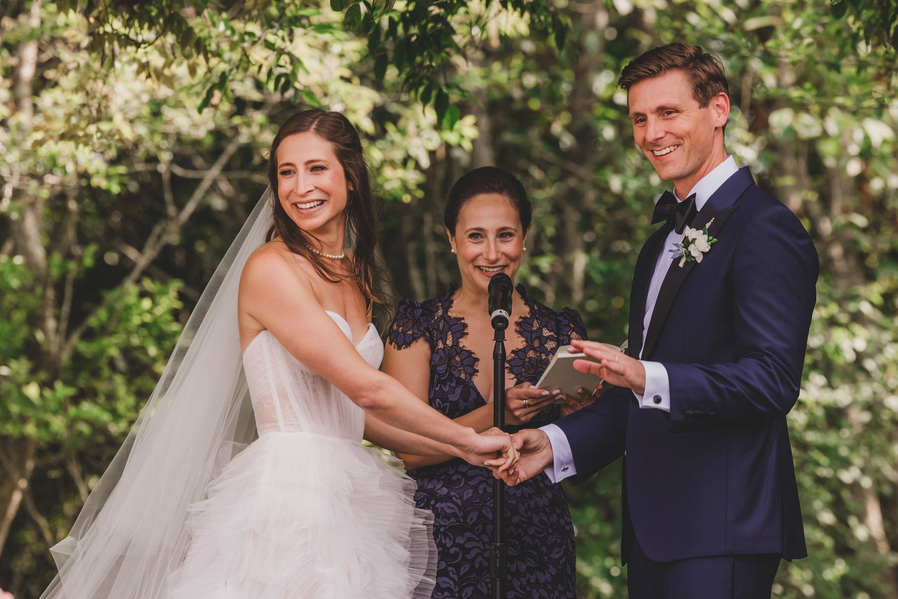 Couple exchanging vows at a garden ceremony on Nantucket